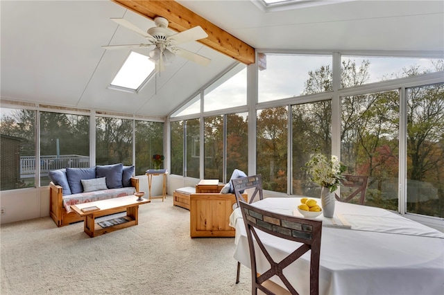 sunroom / solarium with lofted ceiling with skylight, a wealth of natural light, and ceiling fan