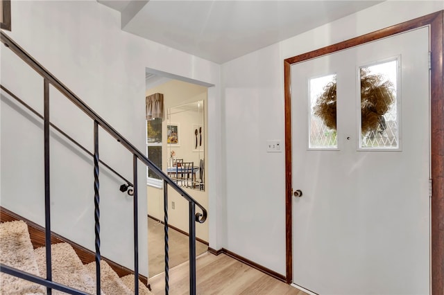 foyer with light hardwood / wood-style floors