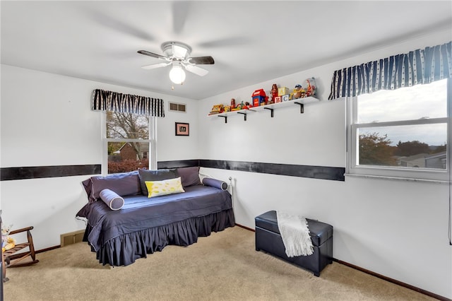 carpeted bedroom with ceiling fan