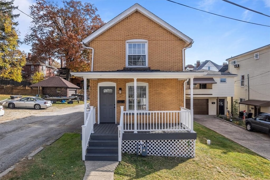 view of front facade with covered porch and a garage