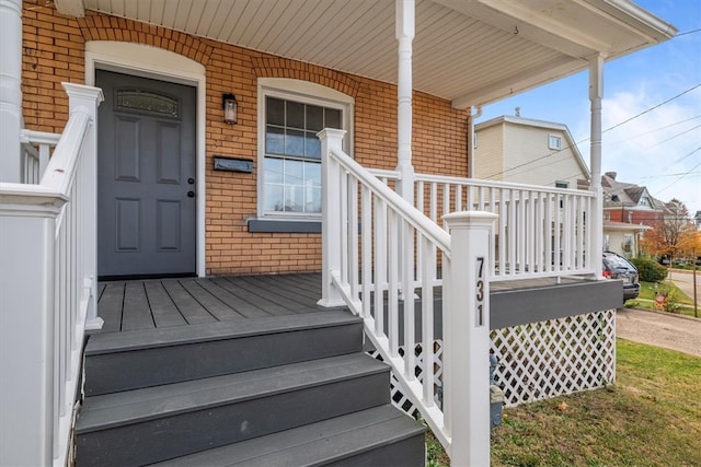 doorway to property featuring covered porch