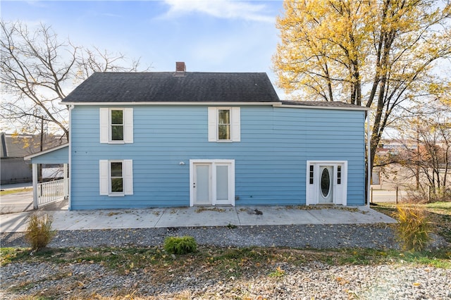 rear view of house featuring french doors and a patio area