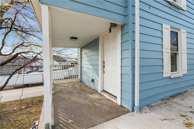 view of property exterior with a porch