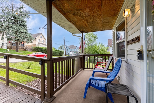 wooden terrace with a porch