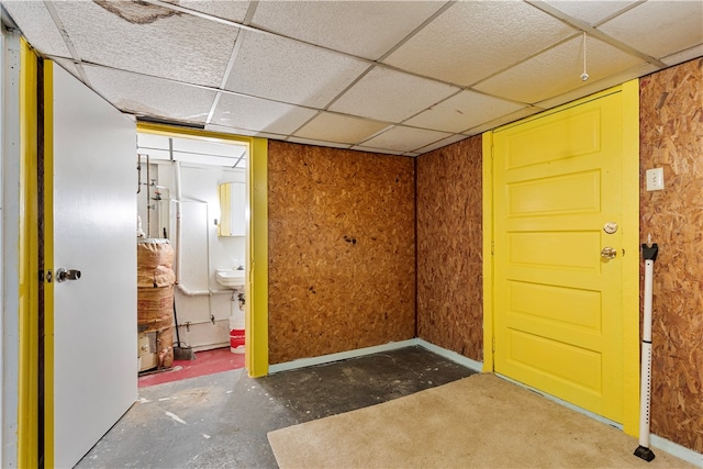 interior space with sink and a drop ceiling