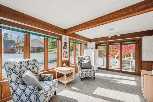 sunroom / solarium with beam ceiling