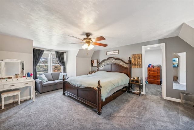 carpeted bedroom with vaulted ceiling and ceiling fan