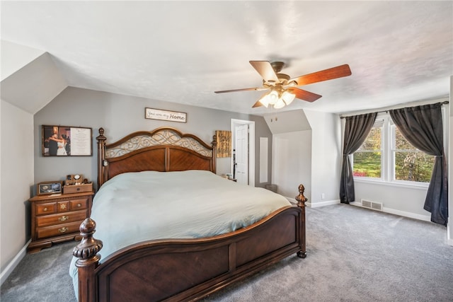 bedroom with ceiling fan, lofted ceiling, and carpet floors