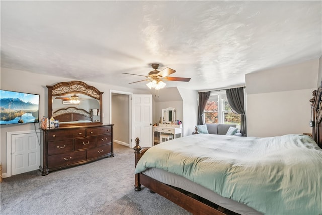 carpeted bedroom featuring lofted ceiling and ceiling fan