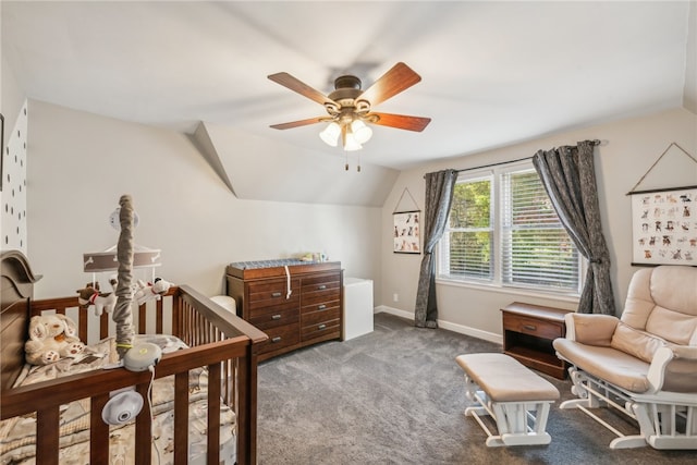 carpeted bedroom featuring lofted ceiling, a nursery area, and ceiling fan