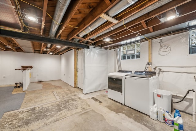 basement featuring washing machine and clothes dryer