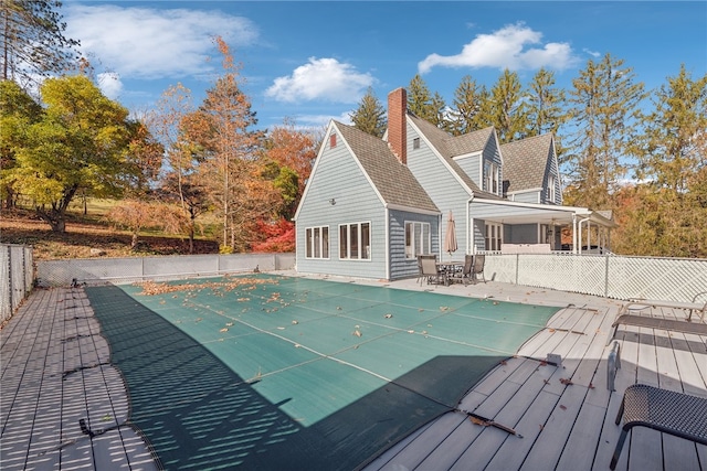 view of swimming pool featuring a wooden deck