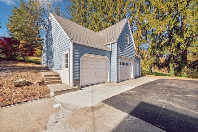 view of side of home featuring a garage