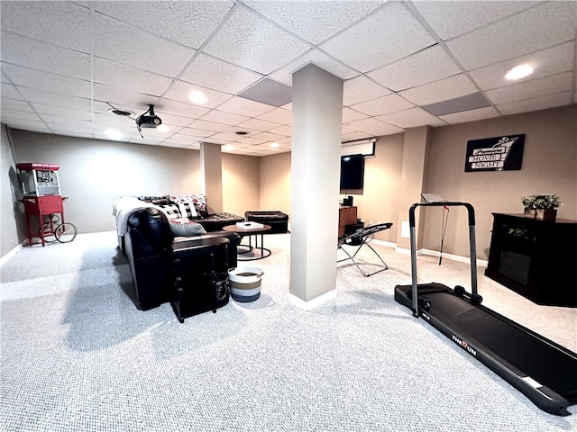 workout area with a paneled ceiling and carpet floors