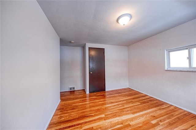 unfurnished room featuring light hardwood / wood-style flooring