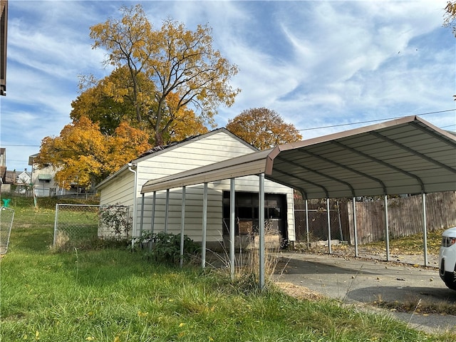 view of parking / parking lot featuring a carport