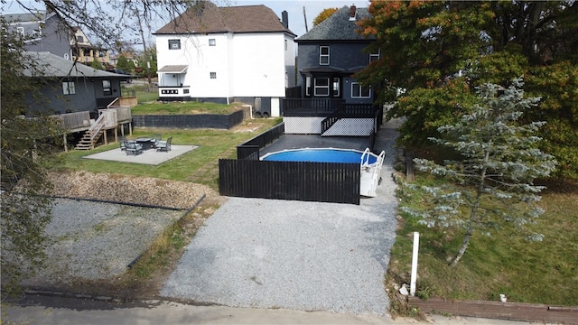 view of yard featuring a patio area and a deck