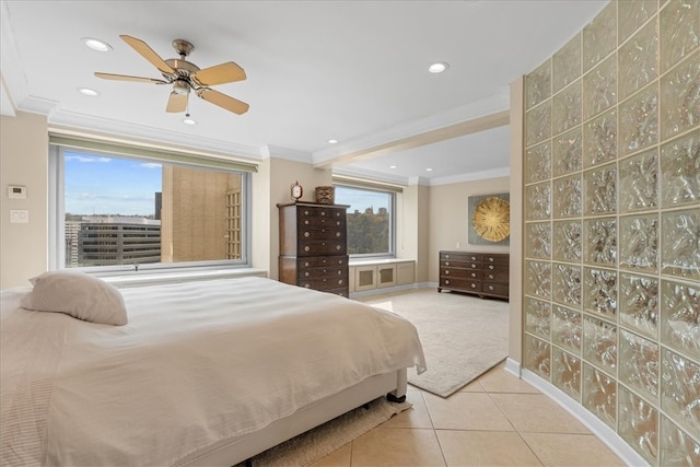 bedroom featuring ceiling fan, crown molding, and light tile patterned flooring