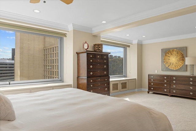 carpeted bedroom featuring ornamental molding and ceiling fan