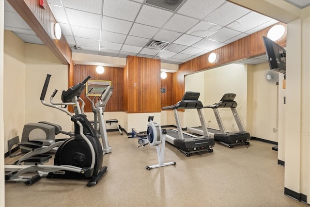 exercise room with a paneled ceiling