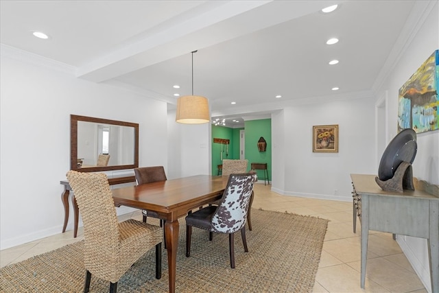 tiled dining area featuring ornamental molding