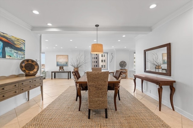 dining room with ornamental molding and light tile patterned floors