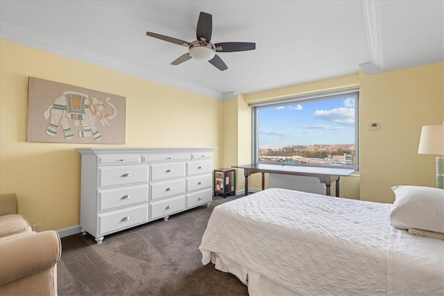 bedroom featuring ornamental molding, dark colored carpet, and ceiling fan