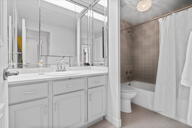 full bathroom with vanity, toilet, shower / bath combination with curtain, and tile patterned flooring