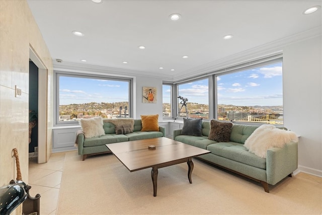 living room featuring ornamental molding and light tile patterned flooring