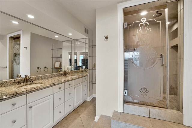 bathroom with vanity, tile patterned floors, and an enclosed shower