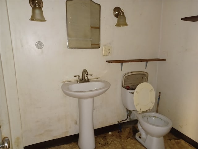 bathroom with toilet and sink