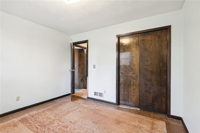 unfurnished bedroom featuring a closet