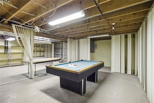 game room with electric panel, pool table, and concrete flooring