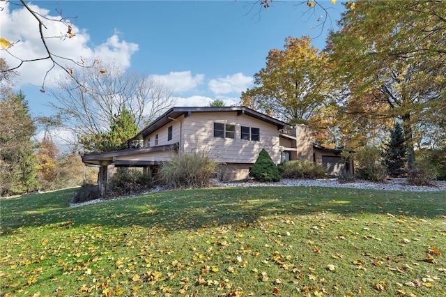 view of side of home with a lawn