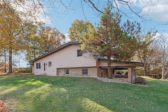 view of home's exterior with a lawn