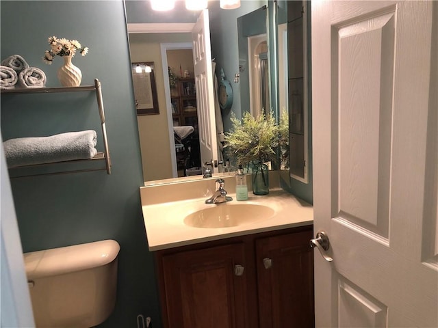 bathroom with vanity and toilet