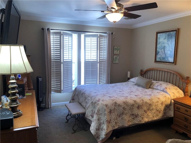 carpeted bedroom with multiple windows, ornamental molding, and a ceiling fan