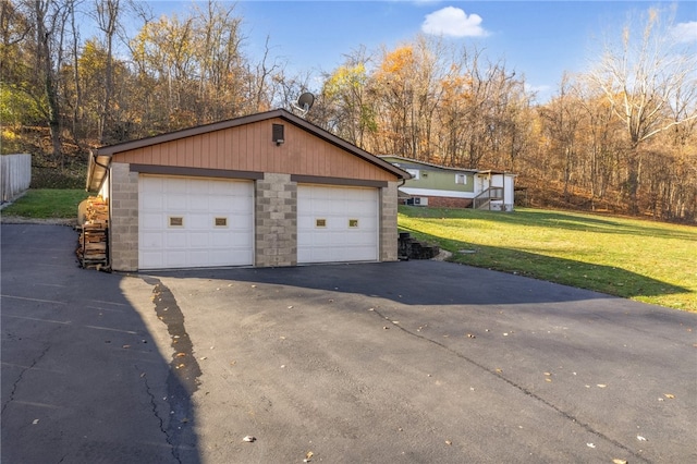 garage featuring a yard