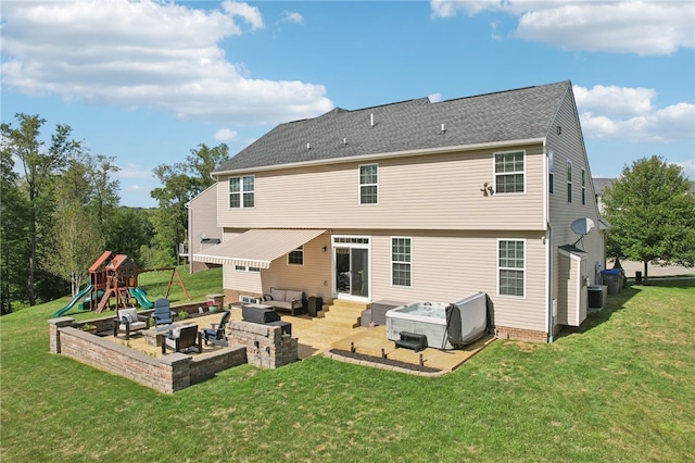 rear view of house with a patio, cooling unit, a lawn, and a playground