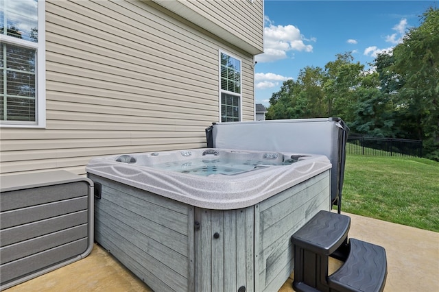 view of patio / terrace with a hot tub