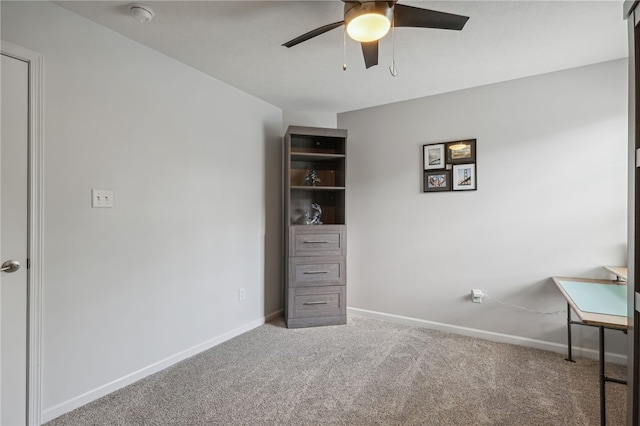 unfurnished bedroom featuring carpet flooring and ceiling fan