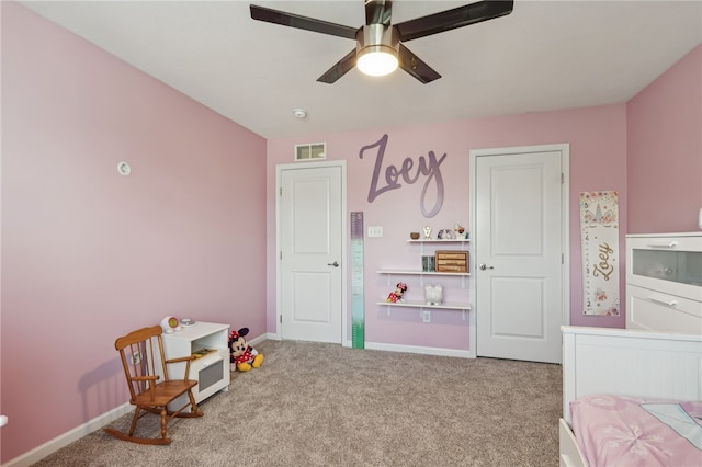 carpeted bedroom featuring ceiling fan