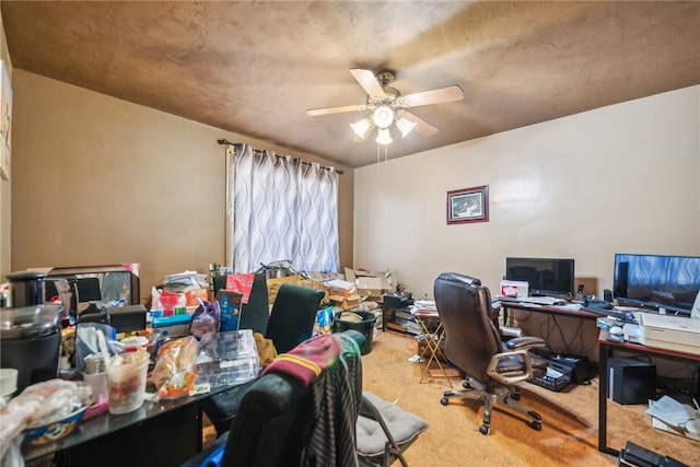 office area with carpet and ceiling fan