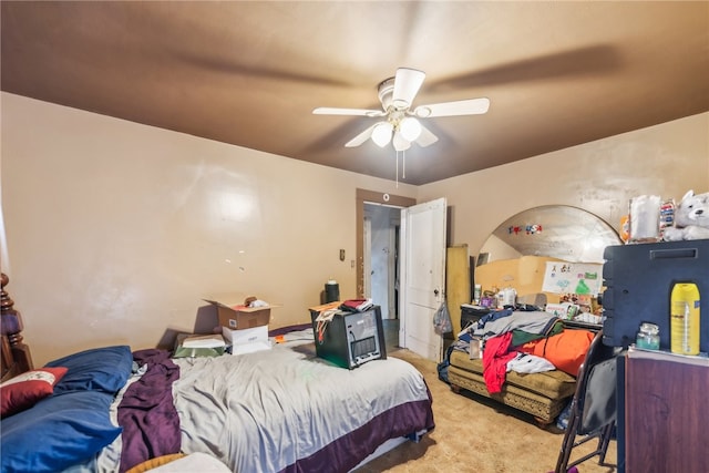 bedroom with light colored carpet and ceiling fan