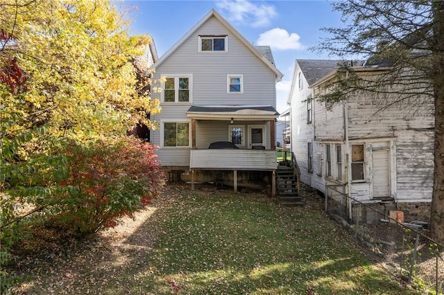 rear view of house with a yard