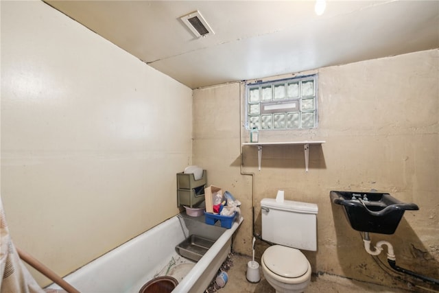 bathroom with toilet and a bathing tub