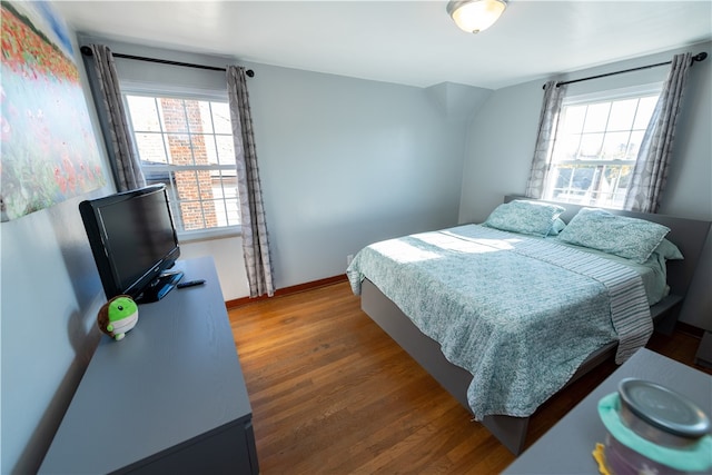 bedroom featuring dark hardwood / wood-style flooring