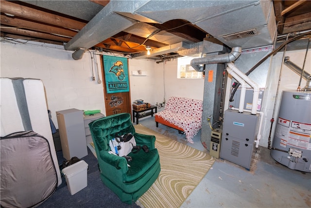 basement featuring heating unit and water heater