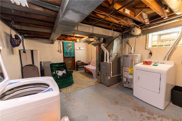 basement featuring washer / clothes dryer, heating unit, and gas water heater