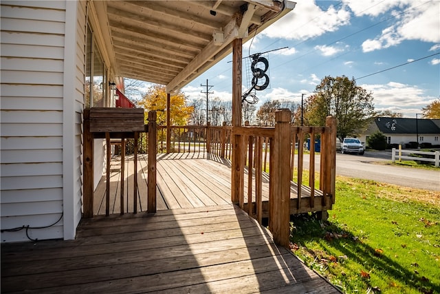 deck featuring a lawn